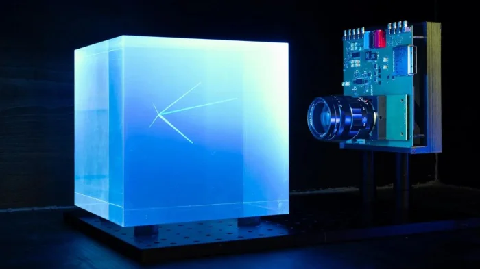Иллюстрация первого прототипа новой монолитной детекторной системы, способной выполнять сверхбыструю, трехмерную и высокоразрешающую визуализацию частиц в больших объемах несегментированного сцинтилляционного материала.
